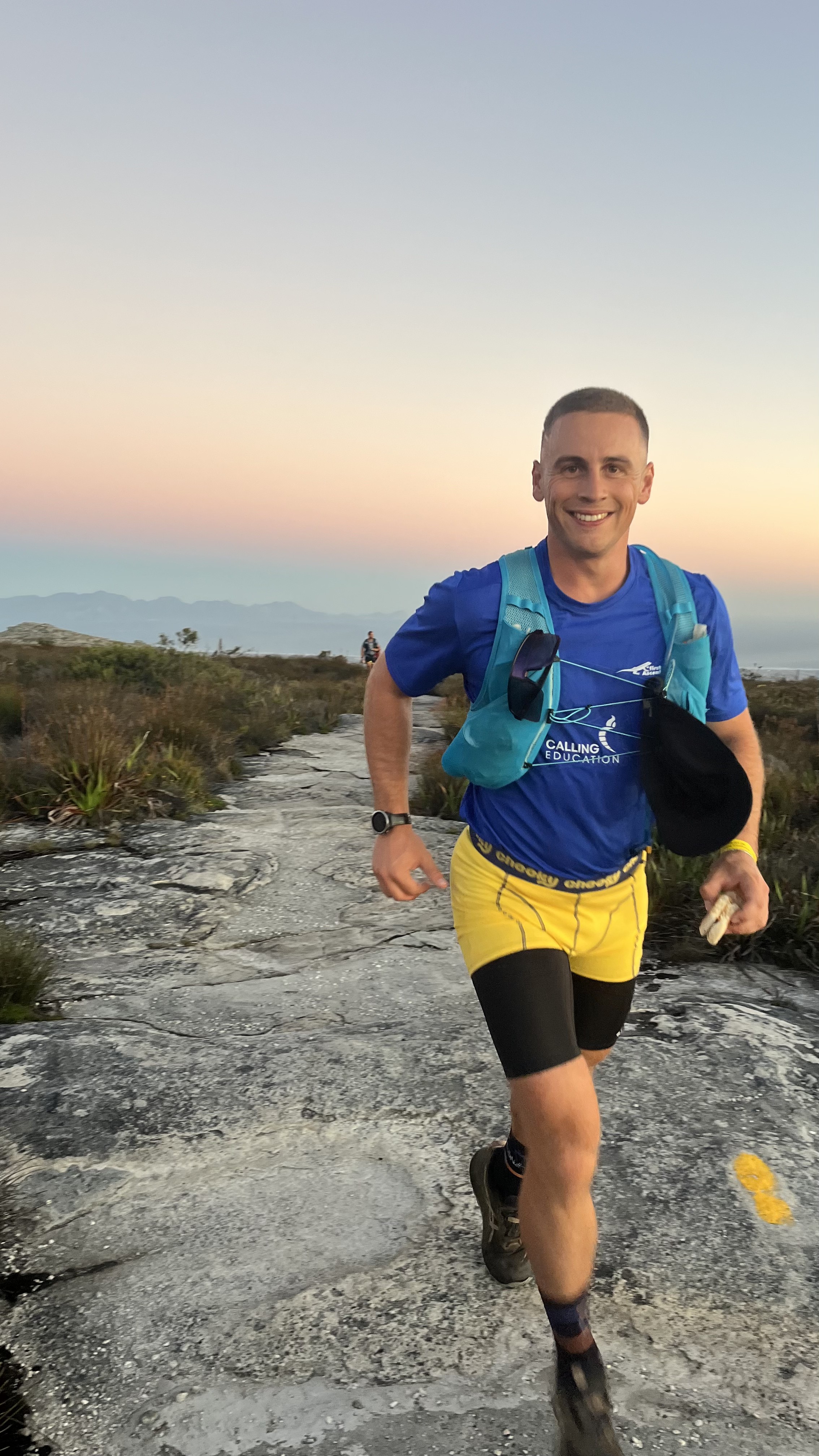 Greg Bolus running on a mountain trail